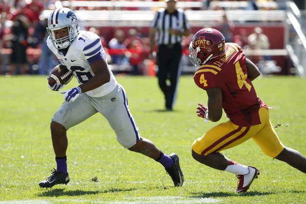 AMES, IA - SEPTEMBER 6: Wide receiver Tyler Lockett #16 of the Kansas State Wildcats rushes for yards past defensive back Sam E. Richardson #4 of the Iowa State Cyclones in the second half of play at Jack Trice Stadium on September 6, 2014 in Ames, Iowa. Kansas State won 32-28 over the Iowa State Cyclones. (Photo by David Purdy/Getty Images)