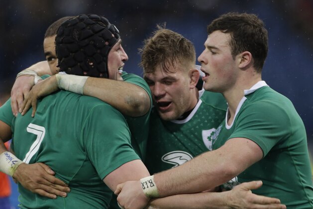 Ireland's Sean O'Brien, left, is cheered by teammates after scoring a try during the Six Nations Rugby Union match between Italy and Ireland at Rome's Olympic stadium, Saturday, Feb. 7, 2015. (AP Photo/Gregorio Borgia)