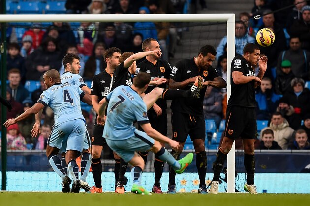 MANCHESTER, ENGLAND - FEBRUARY 07:  James Milner of Manchester City scores the equalising goal during the Barclays Premier League match between Manchester City and Hull City at the Etihad Stadium on February 7, 2015 in Manchester, England.  (Photo by Mike Hewitt/Getty Images)