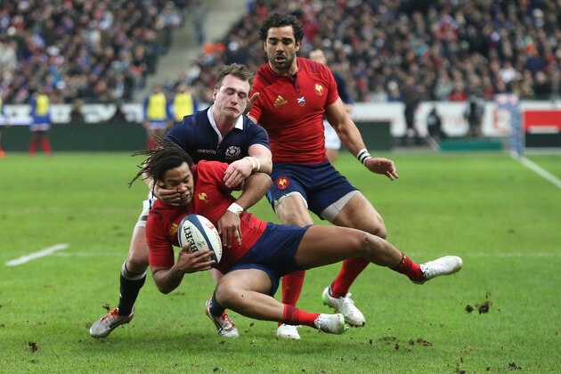 PARIS, FRANCE - FEBRUARY 07:  Teddy Thomas of France is tackled by Stuart Hogg during the RBS Six Nations match between France and Scotland at Stade de France on February 7, 2015 in Paris, France.  (Photo by David Rogers/Getty Images)