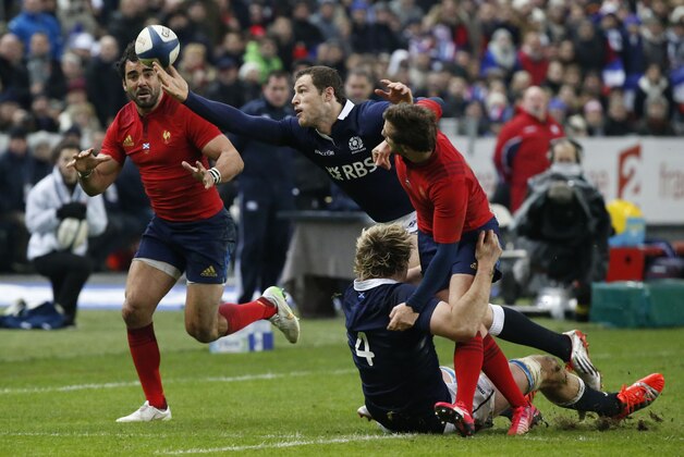 Yoanne Huget, left, Scotland's Tim Visser, second left, Scotland's Richie Gray, second right, and France's Camille Lopez go for the ball during their six nations rugby union international match between France and Scotland at the Stade de France stadium in Saint Denis, outside Paris, Saturday Feb. 7, 2015. France won 15-8. (AP Photo/Michel Euler)