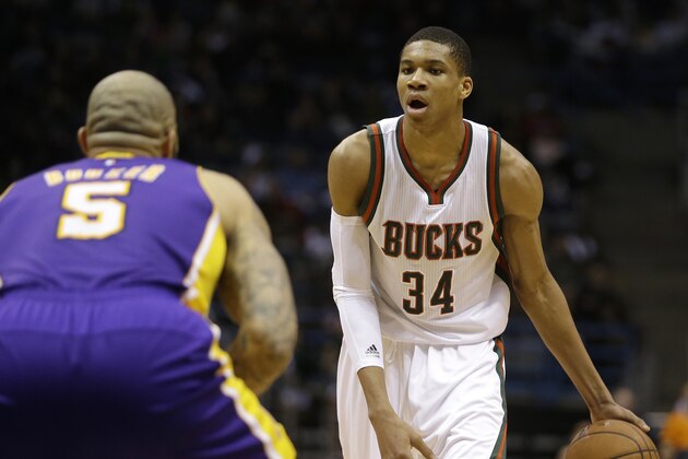 Milwaukee Bucks' Giannis Antetokounmpo dribbles against Los Angeles Lakers' Carlos Boozer during an NBA basketball game Wednesday, Feb. 4, 2015, in Milwaukee. (AP Photo/Aaron Gash)