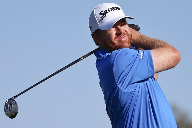 J. B. Holmes watches his tee shot on the second hole of the south course at Torrey Pines during the third round of the Farmers Insurance Open golf tournament Saturday, Feb. 7, 2015, in San Diego. (AP Photo/Lenny Ignelzi)