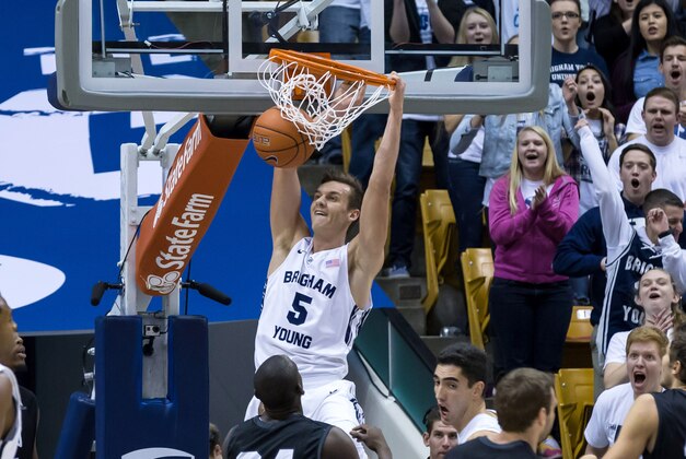 Jan 10, 2015; Provo, UT, USA; Brigham Young Cougars guard Kyle Collinsworth (5) dunks the basketball against the Loyola Marymount Lions during the first half at Marriott Center. Mandatory Credit: Chris Nicoll-USA TODAY Sports