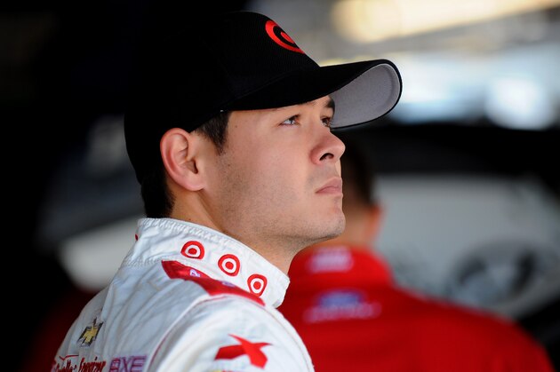KANSAS CITY, KS - MAY 09: Kyle Larson, driver of the #42 Target Chevrolet, stands in the garage area during practice for the NASCAR Sprint Cup Series 5-Hour Energy 400 at Kansas Speedway on May 9, 2014 in Kansas City, Kansas.  (Photo by Will Schneekloth/Getty Images)