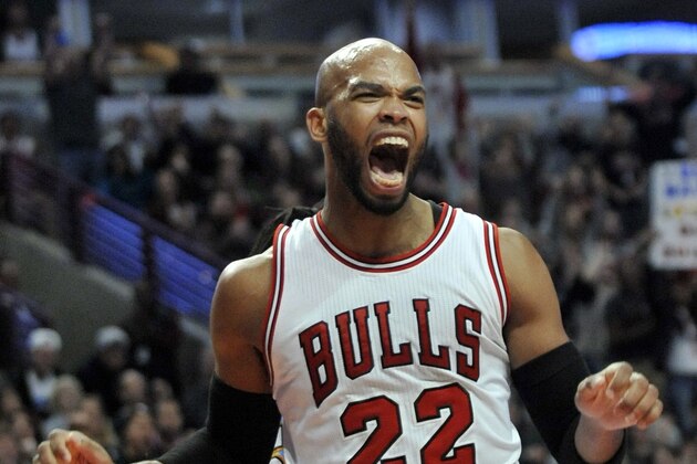 Chicago Bulls' Taj Gibson (22) celebrates after dunking during the second half of an NBA basketball game against the Denver Nuggets in Chicago, Thursday, Jan. 1, 2015. Chicago won 106-101. (AP Photo/Paul Beaty)