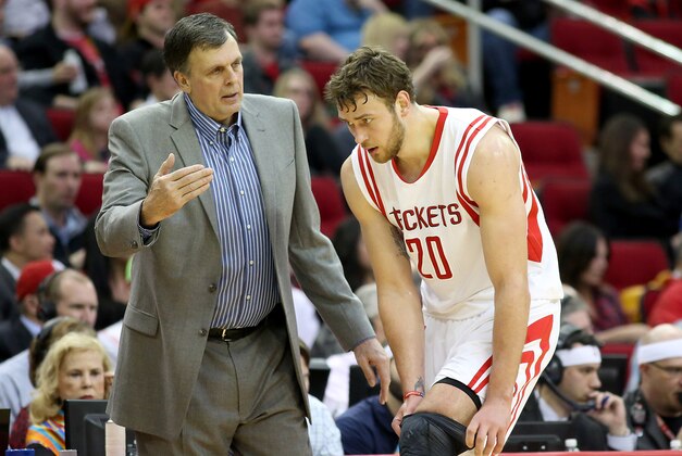 Feb 4, 2015; Houston, TX, USA; Houston Rockets head coach Kevin McHale talks with forward Donatas Motiejunas (20) on the sidelines during a Chicago Bulls timeout in the first half at Toyota Center. Mandatory Credit: Thomas B. Shea-USA TODAY Sports