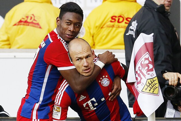 Bayern's Arjen Robben from the Netherlands, right, and team mate David Alaba celebrate their side's opening goal by Robben during the German first division Bundesliga soccer match between VfB Stuttgart and Bayern Munich in Stuttgart, Germany, Saturday, Feb.7,  2015. (AP Photo/Michael Probst)