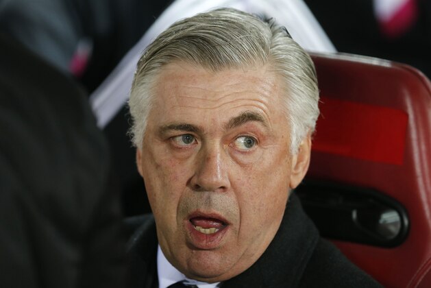 Real Madrid's coach Carlo Ancelotti waits for the start of a round of 16, 1st leg, Copa del Rey soccer match between Atletico de Madrid and Real Madrid at the Vicente Calderon stadium in Madrid, Spain, Wednesday Jan. 7, 2015. (AP Photo/Paul White)