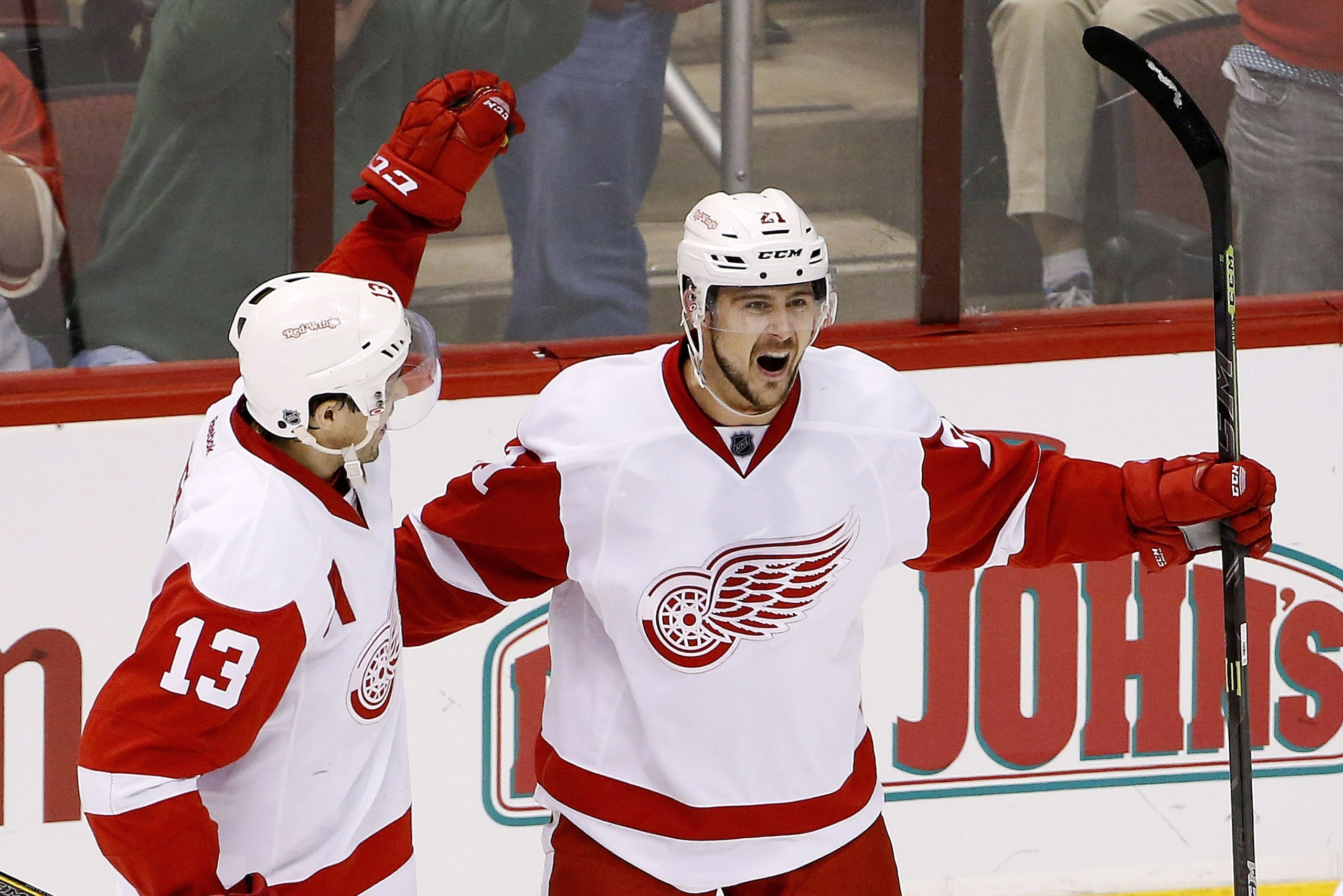 Detroit Red Wings' Tomas Tatar (21), of the Czech Republic, celebrates his goal against the Arizona Coyotes with Pavel Datsyuk (13), of Russia, during the third period of an NHL hockey game Saturday, Feb. 7, 2015, in Glendale, Ariz.  The Red Wings defeated the Coyotes 3-1. (AP Photo/Ross D. Franklin)