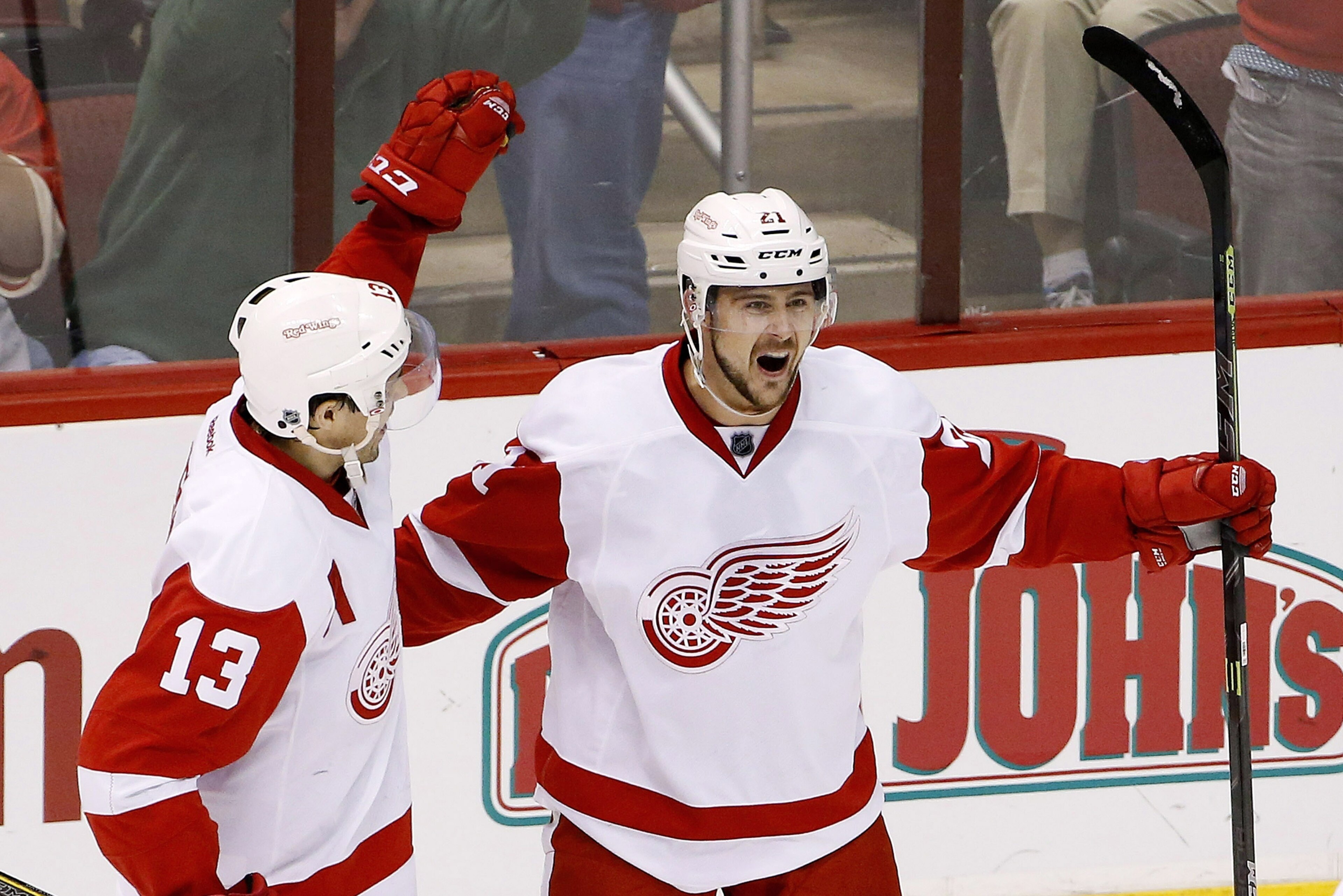 Detroit Red Wings' Tomas Tatar (21), of the Czech Republic, celebrates his goal against the Arizona Coyotes with Pavel Datsyuk (13), of Russia, during the third period of an NHL hockey game Saturday, Feb. 7, 2015, in Glendale, Ariz.  The Red Wings defeated the Coyotes 3-1. (AP Photo/Ross D. Franklin)