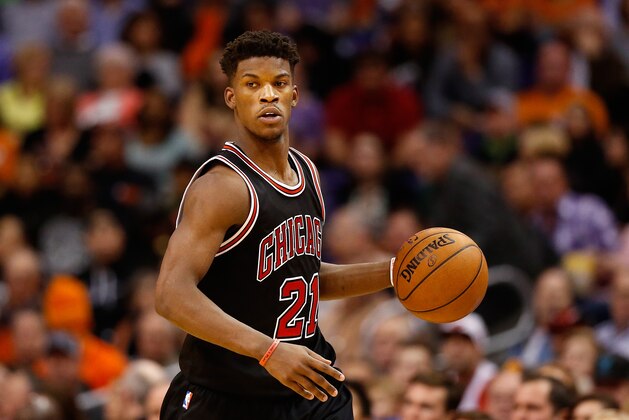 PHOENIX, AZ - JANUARY 30:  Jimmy Butler #21 of the Chicago Bulls handles the ball during the NBA game against the Phoenix Suns at US Airways Center on January 30, 2015 in Phoenix, Arizona. The Suns defeated the Bulls 99-93.  NOTE TO USER: User expressly acknowledges and agrees that, by downloading and or using this photograph, User is consenting to the terms and conditions of the Getty Images License Agreement.  (Photo by Christian Petersen/Getty Images)