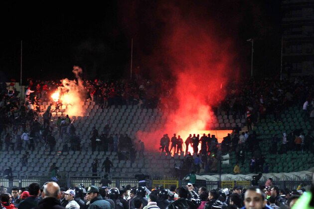 Egyptian fans rush into the field following Al-Ahly club soccer match against Al-Masry club at the soccer stadium in Port Said, Egypt Wednesday, Feb. 1, 2012. Dozens of Egyptians were killed Wednesday in violence following a soccer match in Port Said, when fans flooded the field seconds after a match against a rival team was over, Egypt's Health ministry said. (AP Photo)
