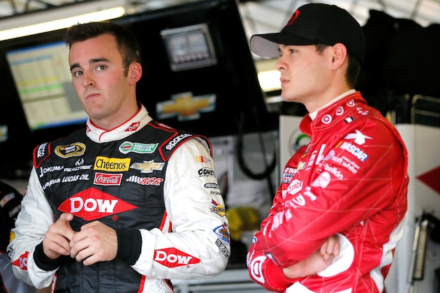 DARLINGTON, SC - APRIL 11:  Austin Dillon, driver of the #3 Dow Chevrolet, and Kyle Larson, driver of the #42 Target Chevrolet, speak in the garage after an incident on track during practice for the NASCAR Sprint Cup Series Bojangles' Southern 500 at Darlington Raceway on April 11, 2014 in Darlington, South Carolina.  (Photo by Kevin C. Cox/Getty Images)