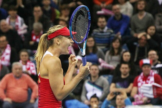 Maria Sharapova of Russia  celebrates  after winning  her match  against  Agnieszka Radwanska of Poland during the Fed Cup World Group first round  tennis match between Poland and Russia in Krakow, Poland, Sunday, Feb. 8, 2015. (AP Photo/Czarek Sokolowski)