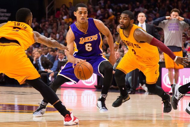 CLEVELAND, OH - FEBRUARY 8: J.R. Smith #5 and Kyrie Irving #2 of the Cleveland Cavaliers try to stop Jordan Clarkson #6 of the Los Angeles Lakers during the first half at Quicken Loans Arena on February 8, 2015 in Cleveland, Ohio. NOTE TO USER: User expressly acknowledges and agrees that, by downloading and or using this photograph, User is consenting to the terms and conditions of the Getty Images License Agreement. (Photo by Jason Miller/Getty Images)