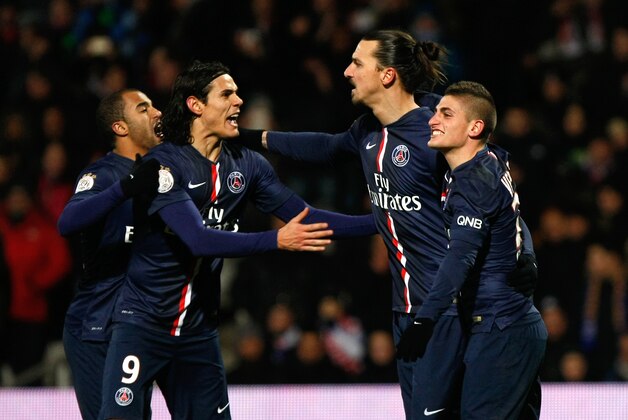 Paris Saint-Germain's Swedish forward Zlatan Ibrahimovic, second right, celebrates scoring against Lyon with teammates during the League One soccer match between Lyon and Paris Saint-Germain at the Gerland Stadium, in Lyon, central France, Sunday Feb. 8, 2015. (AP Photo/Claude Paris)