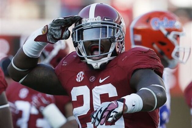 FILE - In this Sept. 20, 2014, file photo, Alabama defensive back Landon Collins celebrates after Alabama sacked Florida's quarterback during the second half of an NCAA college football game in Tuscaloosa, Ala. The College Football Playoff participants are well represented on The Associated Press All-America team. Amari Cooper, third in the Heisman voting, made the first team along with his teammate, safety Landon Collins.  (AP Photo/Brynn Anderson, File)