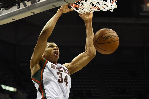 Jan 6, 2015; Milwaukee, WI, USA;  Milwaukee Bucks guard Giannis Antetokounmpo (34) dunks against the Phoenix Suns in the second quarter at BMO Harris Bradley Center. Mandatory Credit: Benny Sieu-USA TODAY Sports