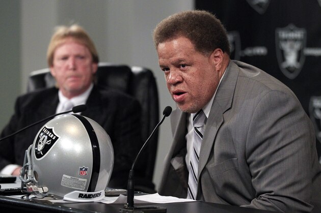 Reggie McKenzie answers questions next to owner Mark Davis, at left, during his introduction as the general manager of the Oakland Raiders NFL football team, during a news conference in Alameda, Calif., Tuesday, Jan. 10, 2012. (AP Photo/Marcio Jose Sanchez)