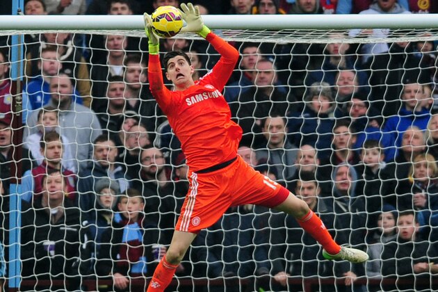 Chelsea goalkeeper Thibaut Courtois makes a save during the English Premier League soccer match between Aston Villa and Chelsea at Villa Park, Birmingham, England, Saturday Feb. 7, 2015. (AP Photo/Rui Vieira)