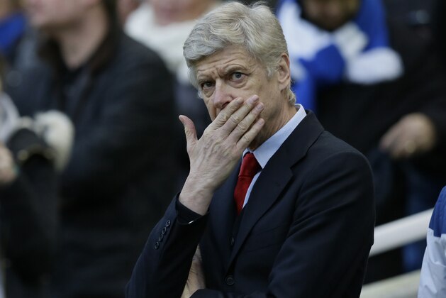 Arsenal manager Arsene Wenger looks across the pitch before the English FA Cup 4th round soccer match between Brighton