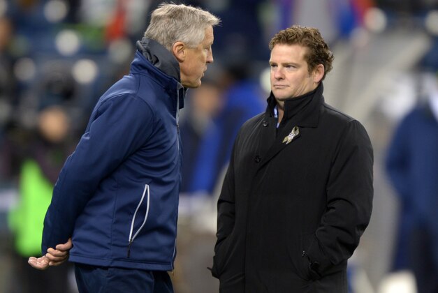 Dec 2, 2013; Seattle, WA, USA; Seattle Seahawks coach Pete Carroll (left) and general manager John Schneider during the game against the New Orleans Saints at CenturyLink Field. The Seahawks defeated the Saints 34-7. Mandatory Credit: Kirby Lee-USA TODAY Sports