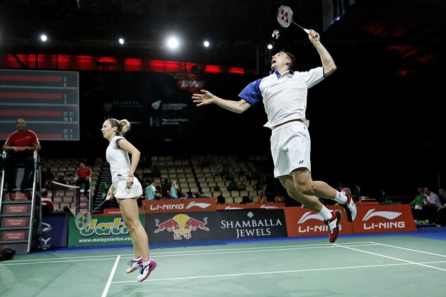 England's fourth seeded mixed double Chris Adcock, right, and Gabrielle Adcock return a shot to Maylaysia's Tan Aik Quan and Lei Pei Jing, not seen, during their match at the World Badminton Championships at Ballerup Arena, Denmark, Tuesday, Aug. 26, 2014. (AP Photo/Jens Dresling, POLFOTO) DENMARK OUT