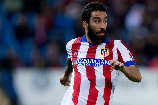 MADRID, SPAIN - DECEMBER 14: Arda Turan of Atletico de Madrid controls the ball during the La Liga match between Club Atletico de Madrid and Villarreal CF at Vicente Calderon Stadium on December 14, 2014 in Madrid, Spain.  (Photo by Gonzalo Arroyo Moreno/Getty Images)