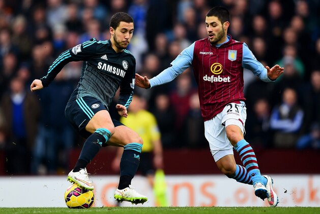 BIRMINGHAM, ENGLAND - FEBRUARY 07:  Eden Hazard of Chelsea battles for the ball with Carles Gil of Aston Villa during the Barclays Premier League match between Aston Villa and Chelsea at Villa Park on February 7, 2015 in Birmingham, England.  (Photo by Laurence Griffiths/Getty Images)