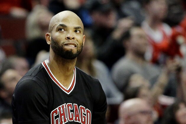 Chicago Bulls forward Taj Gibson (22) looks at a scoreboard during the second half of an NBA basketball game against the Miami Heat in Chicago, Sunday, Jan. 25, 2015. The Heat won 96-84. (AP Photo/Nam Y. Huh)