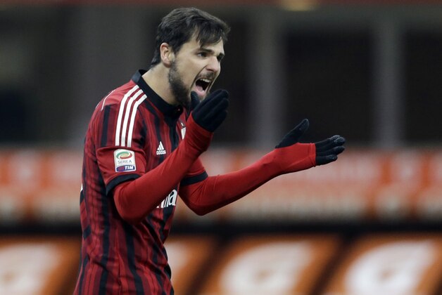 AC Milan's Mattia Destro reacts after missing a scoring chance during a Serie A soccer match between AC Milan and Parma, at the San Siro stadium in Milan, Italy, Sunday, Feb.1, 2015. (AP Photo/Luca Bruno)