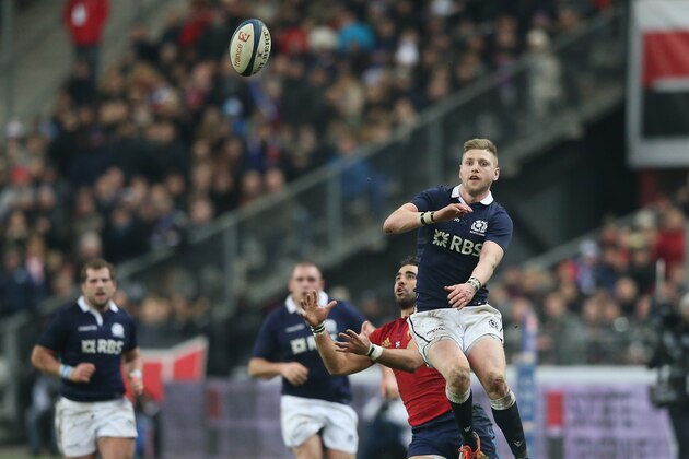 PARIS, FRANCE - FEBRUARY 07:  Finn Russell of Scotland (R) attempts to gather the high ball as Yoann Huget intercepts during the RBS Six Nations match between France and Scotland at Stade de France on February 7, 2015 in Paris, France.  (Photo by David Rogers/Getty Images)