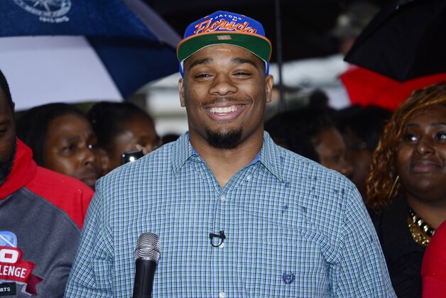 Feb 4, 2015; Glen Saint Mary, FL, USA; Ce Ce Jefferson signs with the University of Florida at his home near  Baker County High School  as his parents Leo and Annette Jefferson look on. Mandatory Credit: Richard Dole-USA TODAY Sports