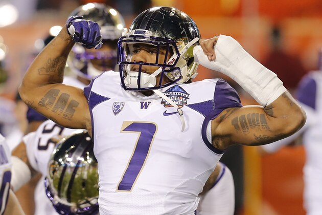 Washington linebacker Shaq Thompson (7) in the first half during the Cactus Bowl NCAA college football game against Oklahoma State, Friday, Jan. 2, 2015, in Tempe, Ariz. (AP Photo/Rick Scuteri)