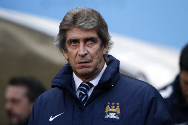 Manchester City's head coach Manuel Pellegrini looks out from the technical area as he watches his team play during the English Premier League soccer match between Manchester City and Arsenal at the Etihad Stadium, Manchester, England, Sunday Jan. 18, 2015. (AP Photo/Jon Super)