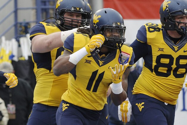 Dec 29, 2014; Memphis, TN, USA; West Virginia Mountaineers wide receiver Kevin White (11) celebrates after scoring a touchdown during the game against the Texas A&M Aggies in the 2014 Liberty Bowl at Liberty Bowl Memorial Stadium. Mandatory Credit: Justin Ford-USA TODAY Sports
