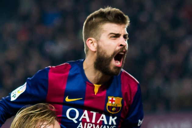BARCELONA, SPAIN - JANUARY 11: Gerard Pique (top) of FC Barcelona celebrates with his teammates after Neymar Santos Jr scored his team's first goal during the La Liga match between FC Barcelona and Club Atletico de Madrid at Camp Nou on January 11, 2015 in Barcelona, Spain. (Photo by Alex Caparros/Getty Images)