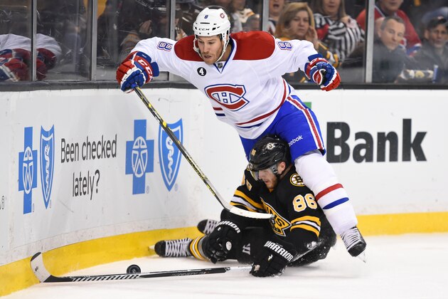 BOSTON, MA - FEBRUARY 8 : Kevan Miller #86 of the Boston Bruins fights for the puck against Brandon Prust #8 of the Montreal Canadiens at the TD Garden on February 8, 2015 in Boston, Massachusetts.  (Photo by Brian Babineau/NHLI via Getty Images)
