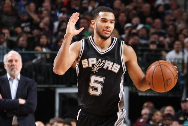 DALLAS, TX - DECEMBER 20: Cory Joseph #5 of the San Antonio Spurs handles the ball against the Dallas Mavericks on December 20, 2014 at the American Airlines Center in Dallas, Texas. NOTE TO USER: User expressly acknowledges and agrees that, by downloading and or using this photograph, User is consenting to the terms and conditions of the Getty Images License Agreement. Mandatory Copyright Notice: Copyright 2014 NBAE (Photo by Danny Bollinger/NBAE via Getty Images)