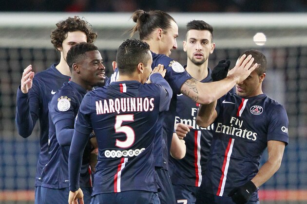 Paris Saint Germain's Zlatan Ibrahimovic, center, celebrates with teammates after scoring the second goal for his team, during the French League One soccer match between Paris Saint Germain and Nantes, at the Parc des Princes stadium in Paris, Saturday Dec. 6, 2014. PSG won on a 2-1 score. (AP Photo/Remy de la Mauviniere)