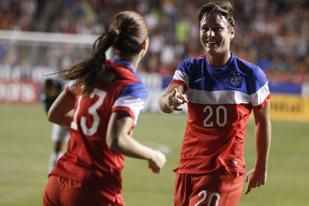 SANDY, UT - SEPTEMBER 13: Abby Wambach #20 and Alex Morgan #13 of the United States celebrate a goal during a game against Mexico during the first half of an international friendly soccer game September 13, 2014 at Rio Tinto Stadium in Sandy, Utah. The Unites States beat Mexico 8-0. (Photo by George Frey/Getty Images)