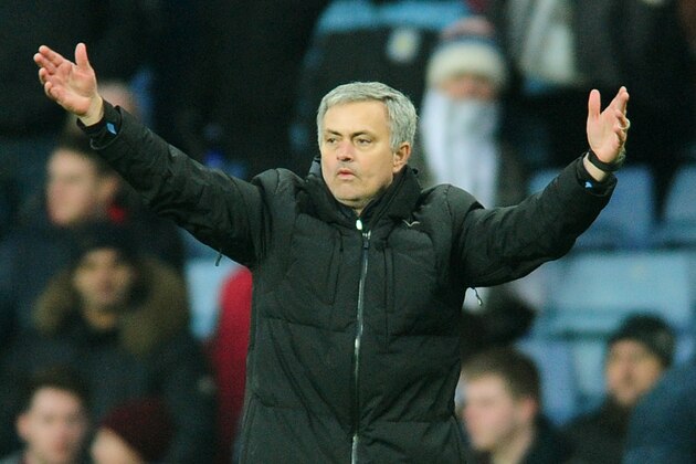 Chelsea manager Jose Mourinho gestures to fans after Chelsea beat Villa 2-1 during the English Premier League soccer match between Aston Villa and Chelsea at Villa Park, Birmingham, England, Saturday, Feb 7, 2015. (AP Photo/Rui Vieira)