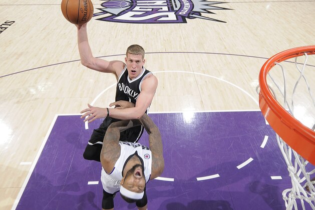 SACRAMENTO, CA - JANUARY 21: Mason Plumlee #1 of the Brooklyn Nets shoots against DeMarcus Cousins #15 of the Sacramento Kings on January 21, 2015 at Sleep Train Arena in Sacramento, California. NOTE TO USER: User expressly acknowledges and agrees that, by downloading and or using this photograph, User is consenting to the terms and conditions of the Getty Images Agreement. Mandatory Copyright Notice: Copyright 2015 NBAE (Photo by Rocky Widner/NBAE via Getty Images)