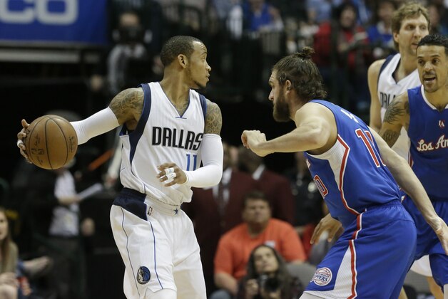 Dallas Mavericks guard Monta Ellis (11) loos to pass against Los Angeles Clippers forward Spencer Hawes (10) during the first quarter of an NBA basketball game Monday, Feb. 9, 2015, in Dallas. (AP Photo/LM Otero)