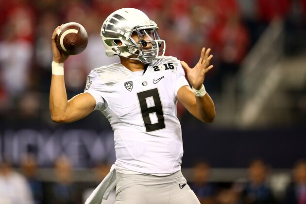 ARLINGTON, TX - JANUARY 12:  Quarterback Marcus Mariota #8 of the Oregon Ducks throws the ball against the Ohio State Buckeyes during the College Football Playoff National Championship Game at AT&T Stadium on January 12, 2015 in Arlington, Texas.  (Photo by Ronald Martinez/Getty Images)