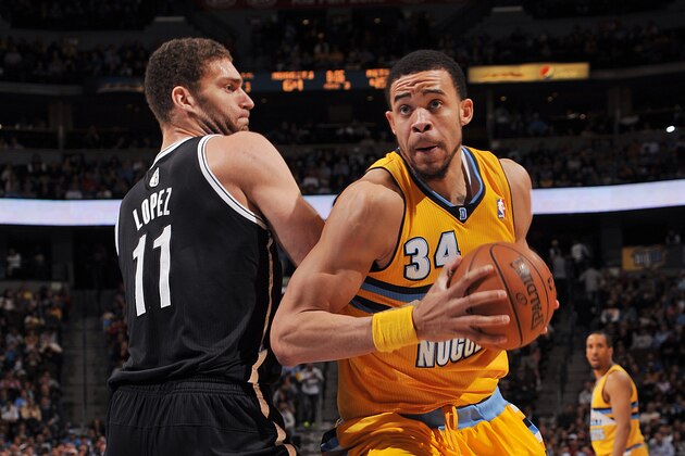 DENVER, CO - MARCH 29:  JaVale McGee #34 of the Denver Nuggets drives against Brook Lopez #11 of the Brooklyn Nets during the game between the Brooklyn Nets and the Denver Nuggets on March 29, 2013 at the Pepsi Center in Denver, Colorado. NOTE TO USER: User expressly acknowledges and agrees that, by downloading and/or using this Photograph, user is consenting to the terms and conditions of the Getty Images License Agreement. Mandatory Copyright Notice: Copyright 2013 NBAE (Photo by Garrett W. Ellwood/NBAE via Getty Images)