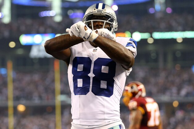 ARLINGTON, TX - OCTOBER 27:  Dez Bryant #88 of the Dallas Cowboys celebrates his touchdown against the Washington Redskins during the first half at AT&T Stadium on October 27, 2014 in Arlington, Texas.  (Photo by Ronald Martinez/Getty Images)
