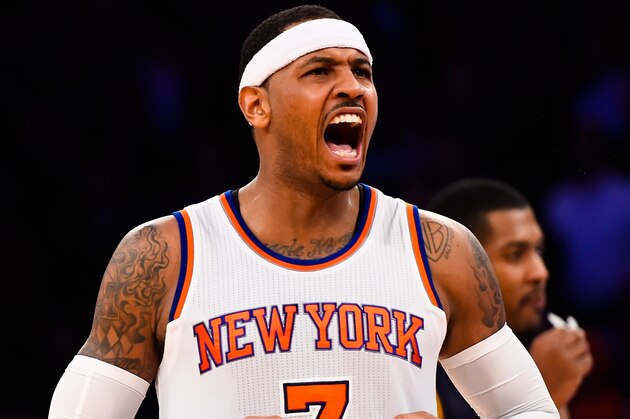 NEW YORK, NY - NOVEMBER 14:  Carmelo Anthony #7 of the New York Knicks celebrates after making a three point basket late in the fourth quarter during a game against the Utah Jazz at Madison Square Garden on November 14, 2014 in New York City. NOTE TO USER: User expressly acknowledges and agrees that, by downloading and/or using this photograph, user is consenting to the terms and conditions of the Getty Images License Agreement.  (Photo by Alex Goodlett/Getty Images)