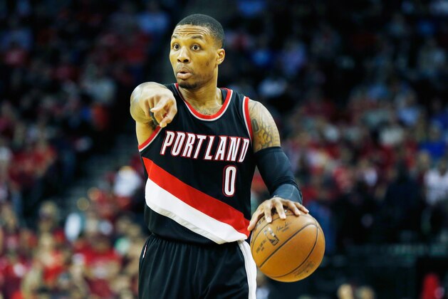 HOUSTON, TX - FEBRUARY 08:  Damian Lillard #0 of the Portland Trail Blazers looks to pass on the court during their game against the Houston Rockets at the Toyota Center on February 8, 2015 in Houston, Texas. NOTE TO USER: User expressly acknowledges and agrees that, by downloading and/or using this photograph, user is consenting to the terms and conditions of the Getty Images License Agreement.  (Photo by Scott Halleran/Getty Images)